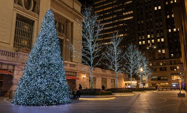Commercial lobby holiday decorations with seasonal greenery and lighting